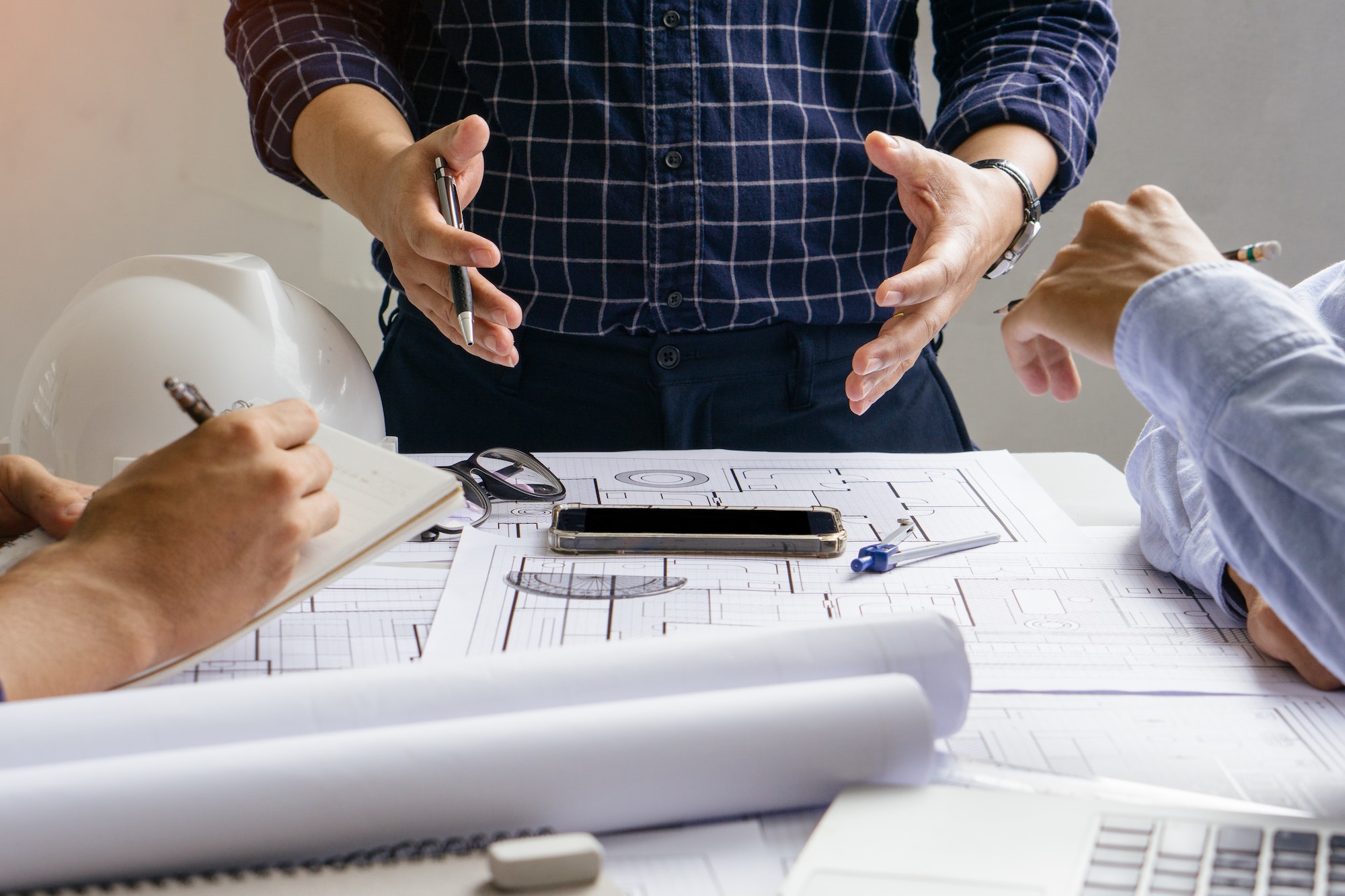 engineer team working in office with blue prints.Team of architects people.